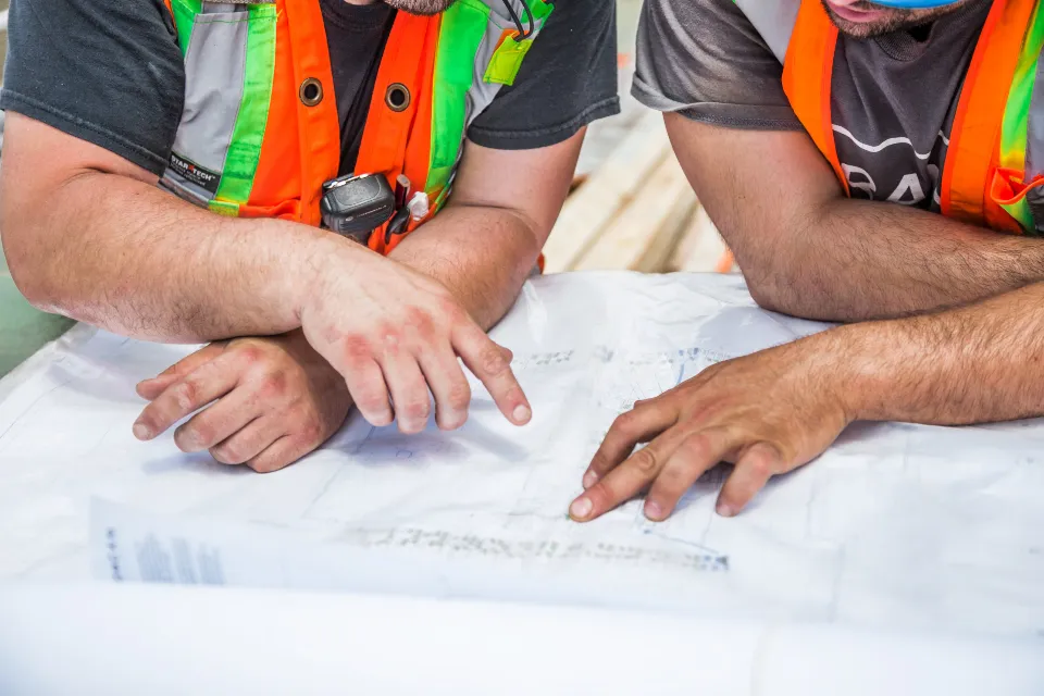 Estimators reviewing construction drawings